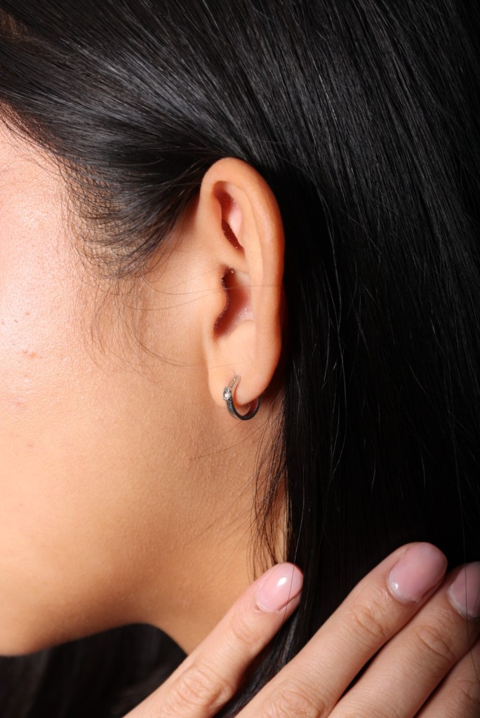 silver earrings worn on girl 